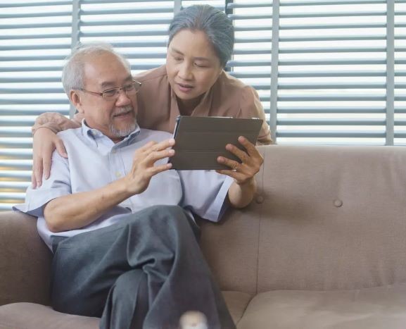 grandfather and grandmother watching video on digi 2023 12 29 22 14 19 utc min 1